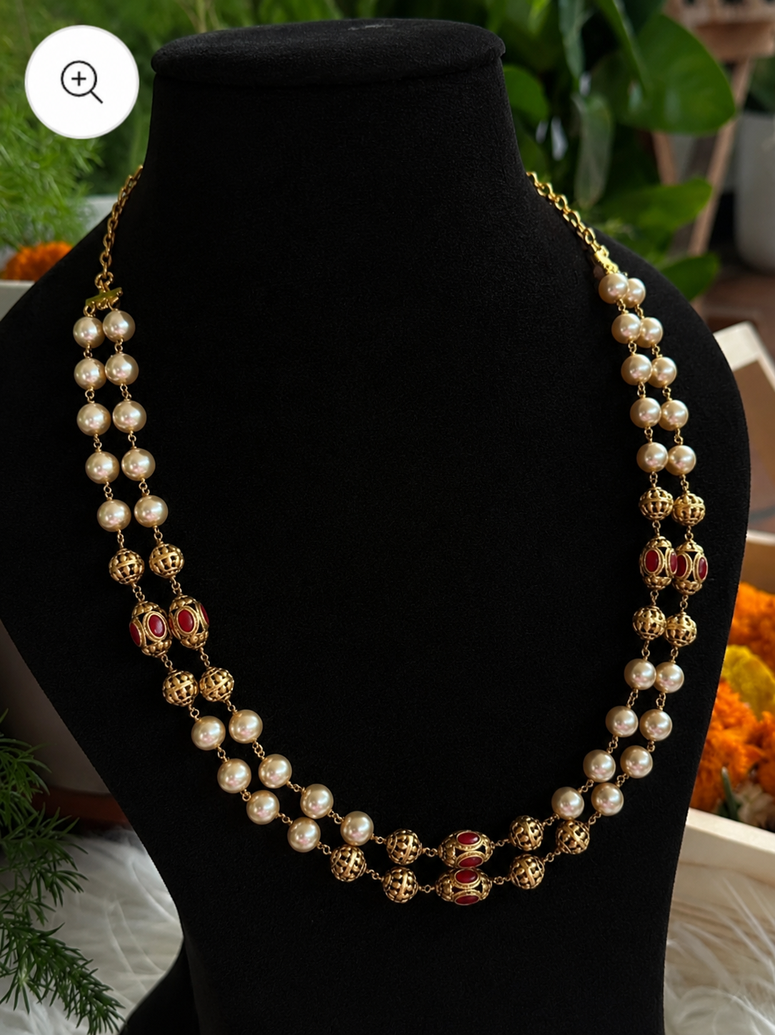 Premium quality traditional double-strand Indian pearl and gold-beaded necklace (mala) featuring cream pearls, intricate open-work golden hollow beads (guttapoosa style), and vibrant ruby-red accent stones