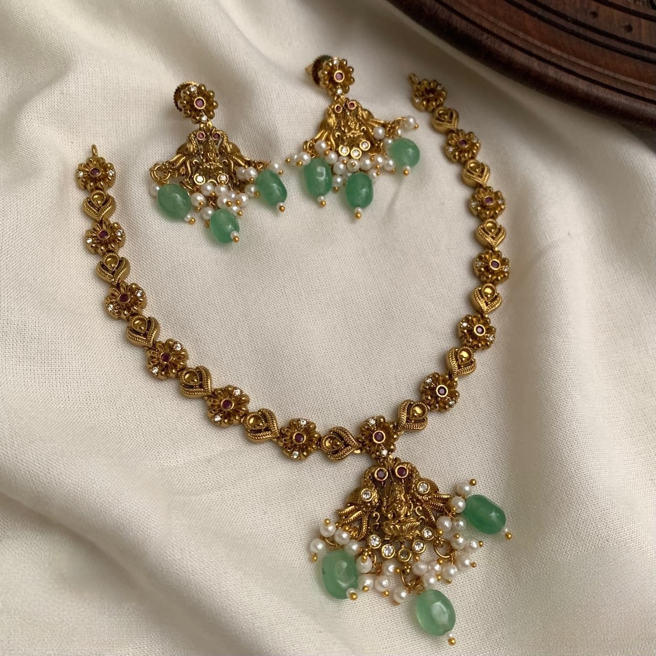 Premium antique gold traditional lakshmi devi floral necklace set product code T111