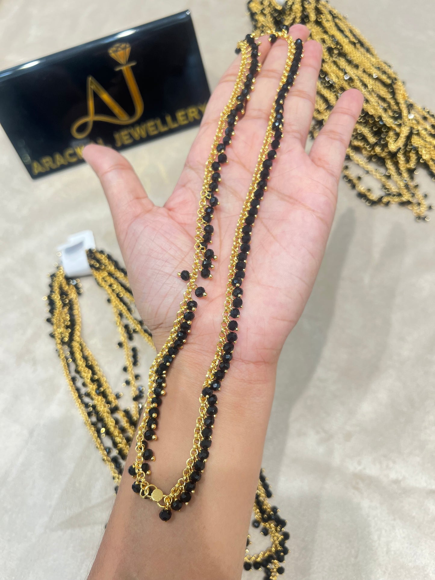 Premium gold plated black beads anklets product code A16