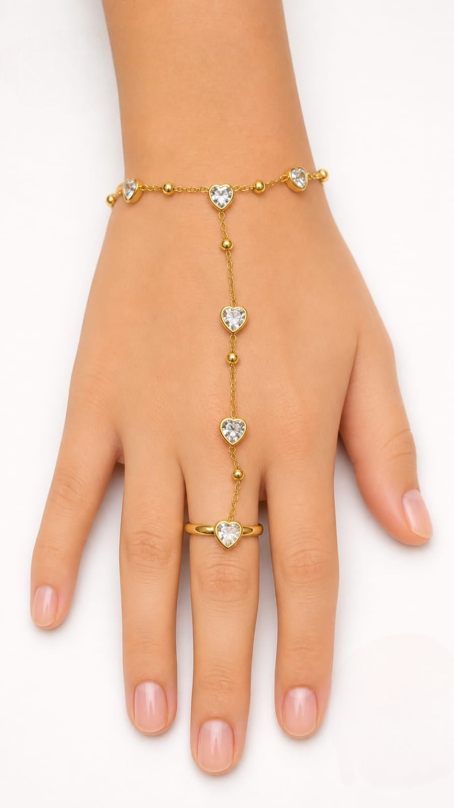 Premium gold-plated heart crystal hand chain featuring a delicate chain connecting a bracelet to a ring with heart-shaped stone accents product code R59