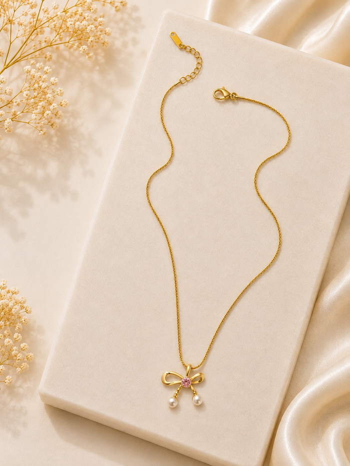 Premium anti tarnish pearl ribbon bow shape pendant chain product code AT11