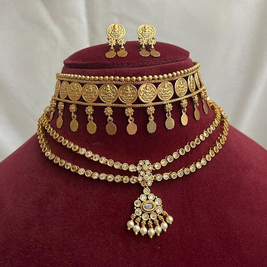 This combo of  Antique temple design necklace set from Cassa Signature features intricate coin motifs and dangling leaf and set of 2pair of earings product code T117