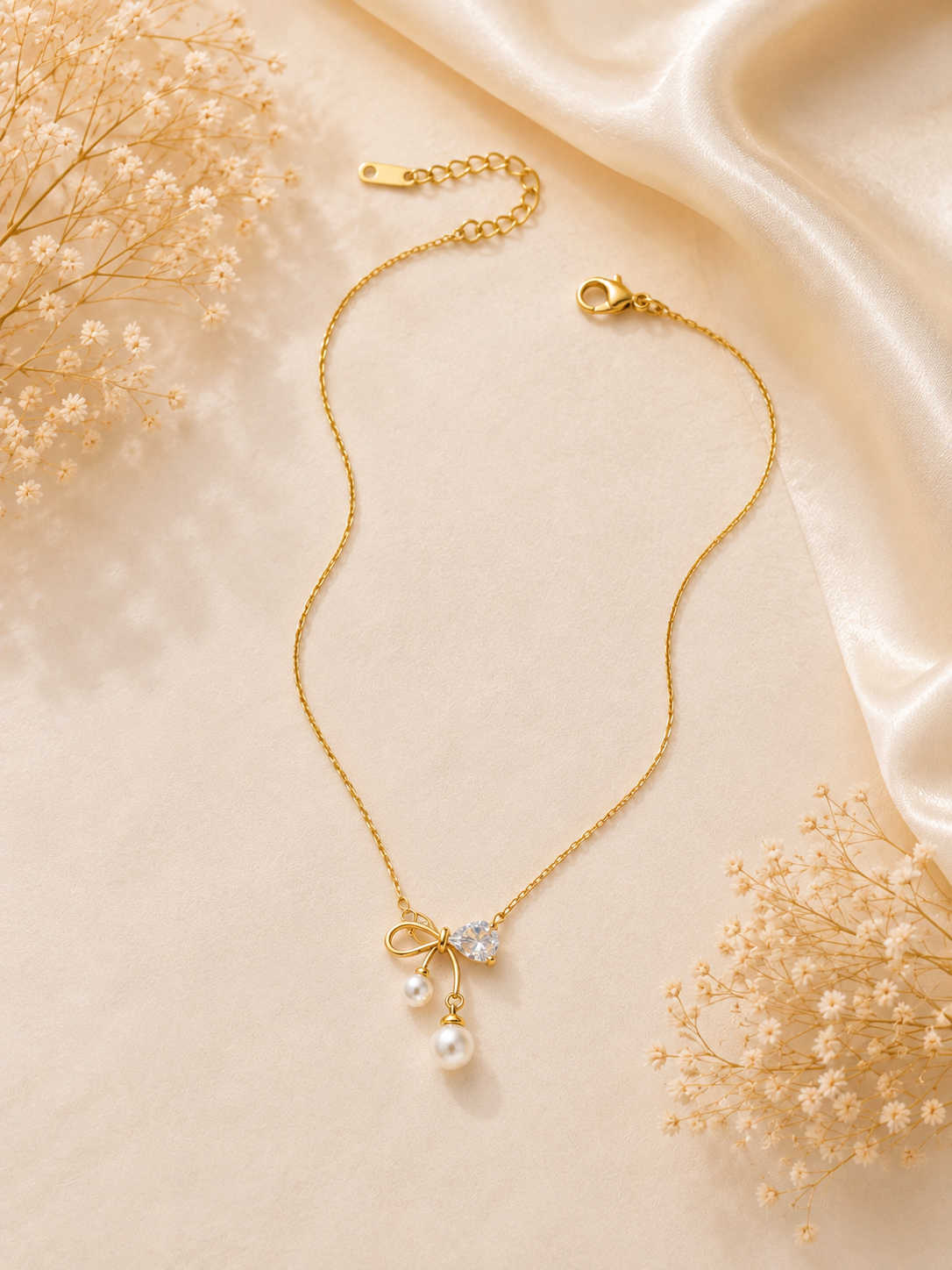 Premium anti tarnish bow shape pearl pendant with chain product code AT13