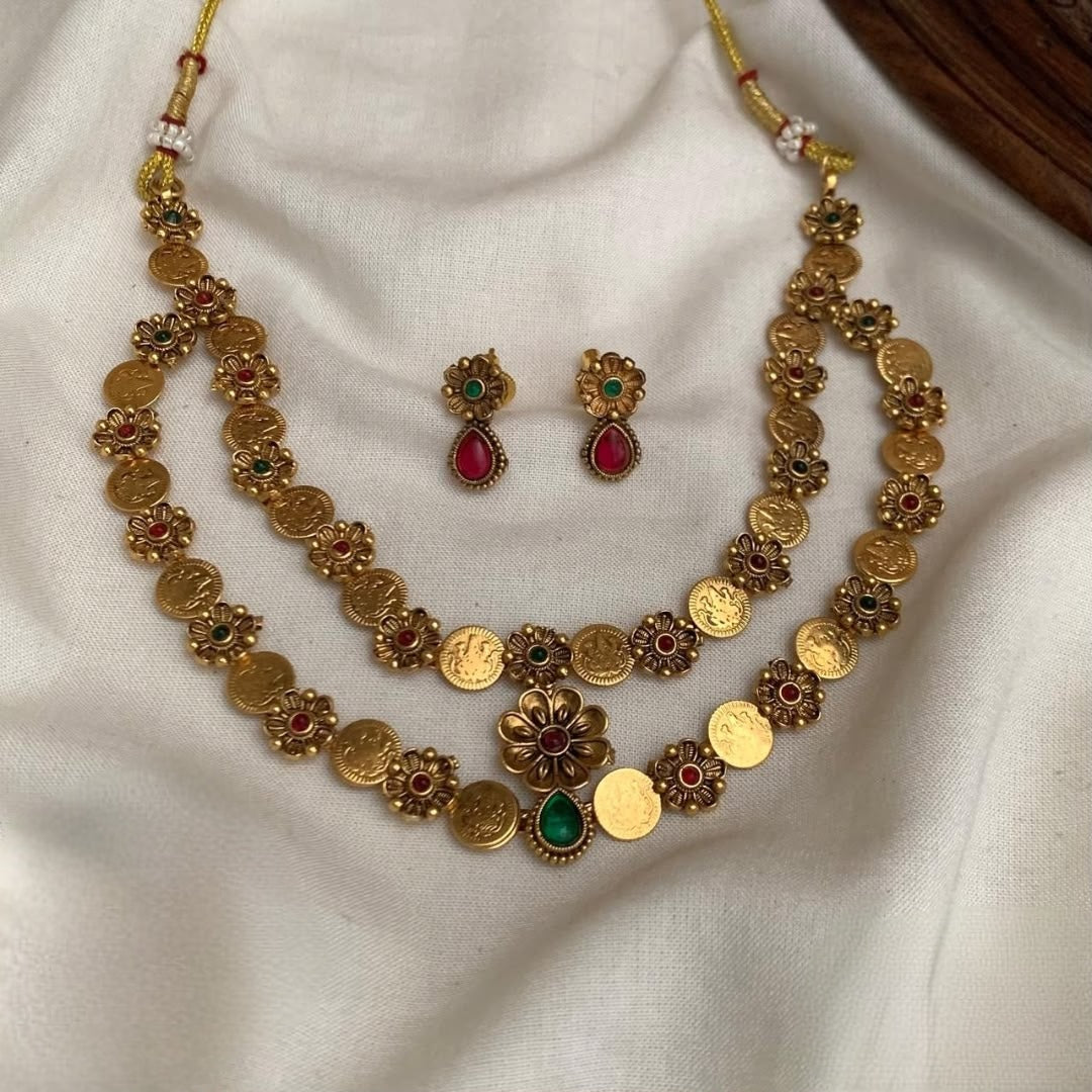 Premium antique gold-plated Lakshmi coin/kasu 2layer necklace set features detailed goddess motifs accented with red/green stones product code T114