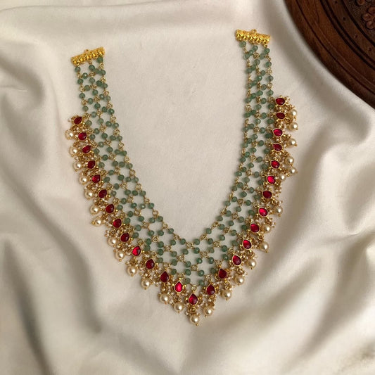 Premium traditional Jadau Kundan Jaali necklace featuring green beads, red stones, and pearl hangings code T70
