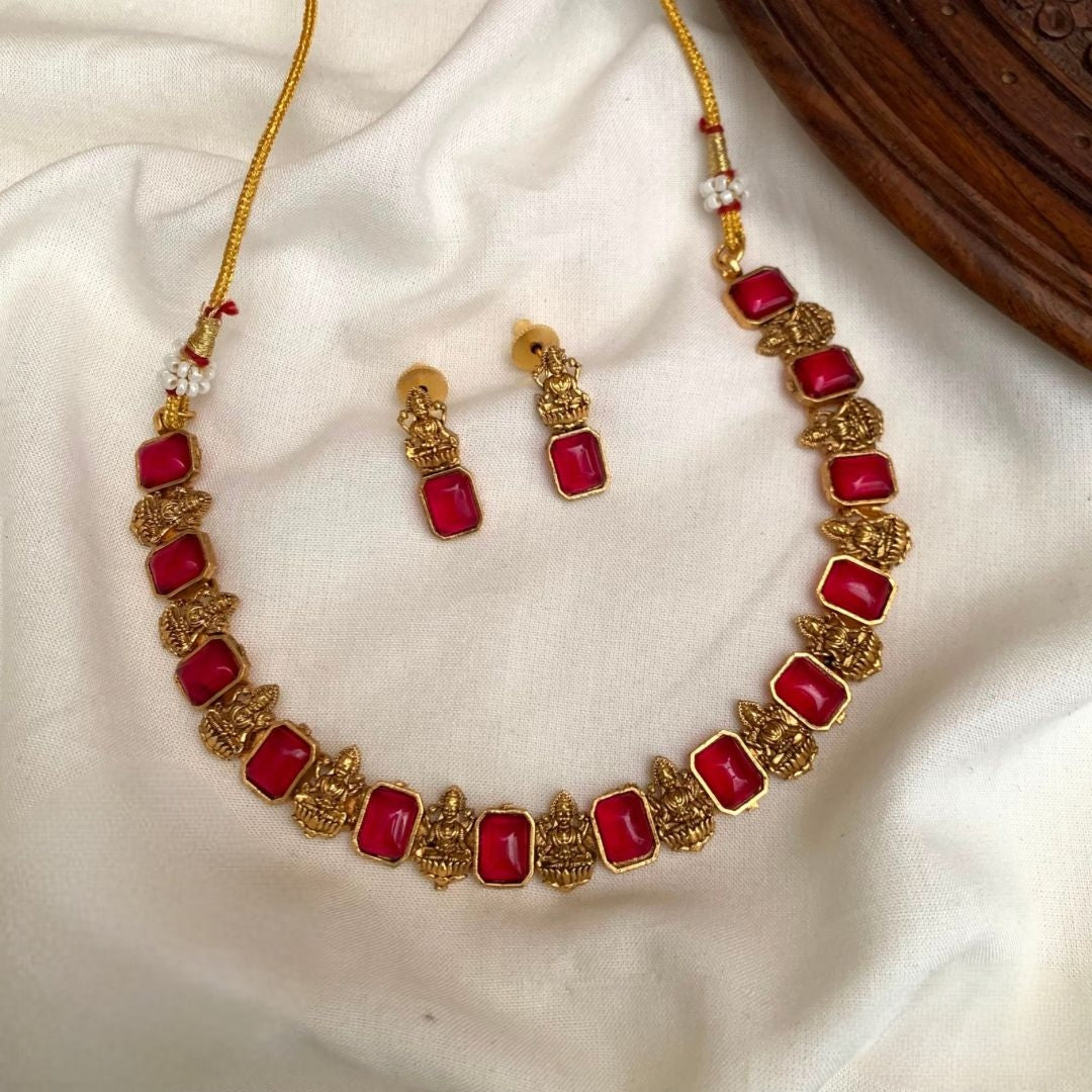 Premium traditional South Indian style with intricate temple-themed deities alternating with green gemstone necklace set product code T110