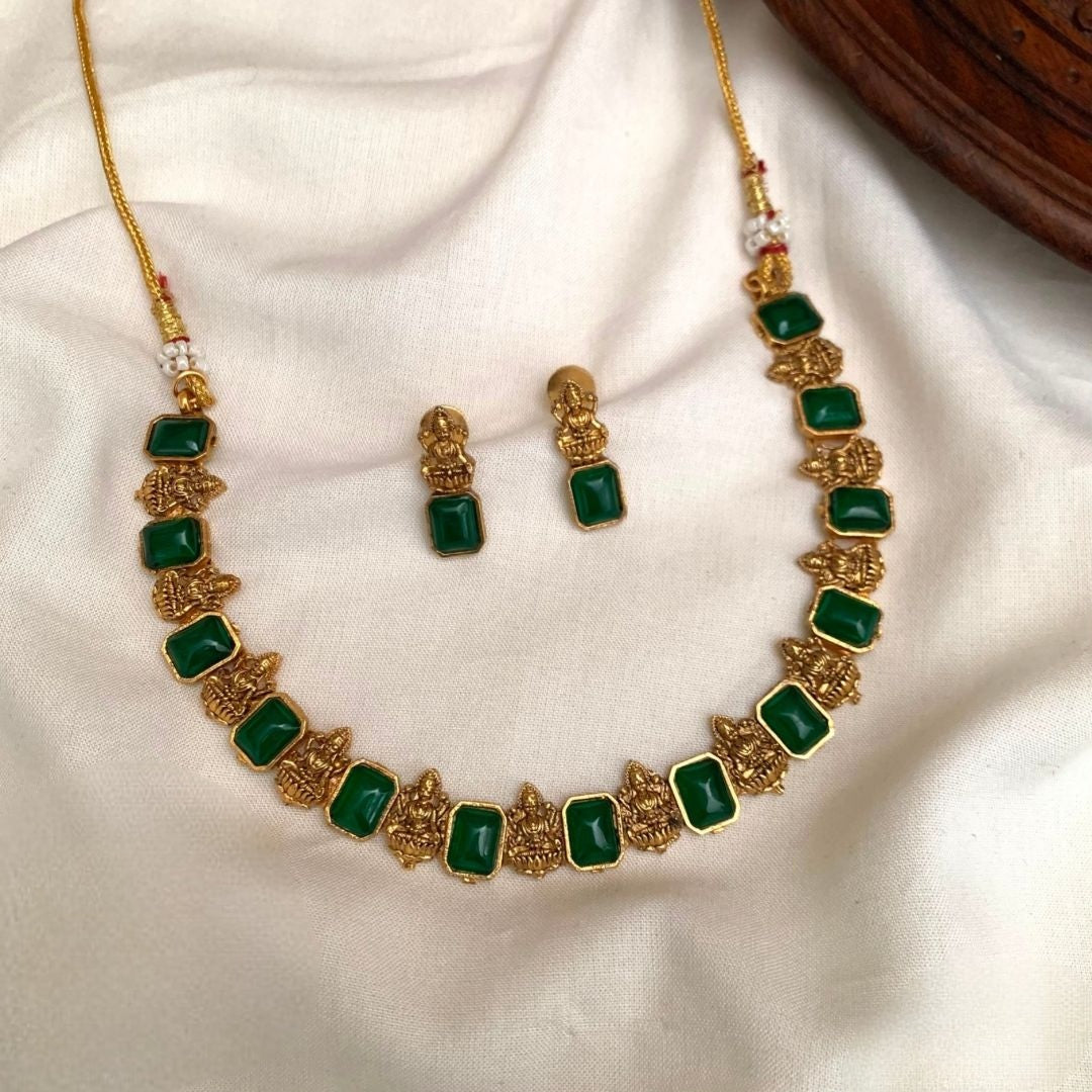 Premium traditional South Indian style with intricate temple-themed deities alternating with green gemstone necklace set product code T110