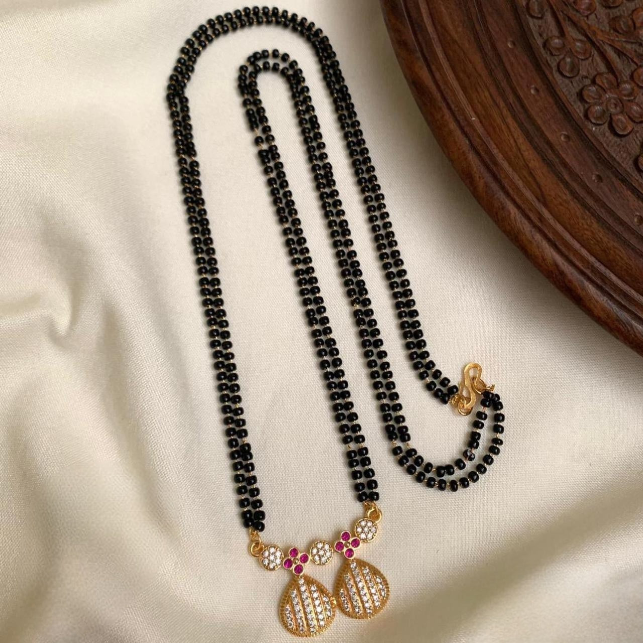 Premium Gold-Plated 2-Line Black Beads Mangalsutra Sets with diamond finish Floral Pendant product code T66